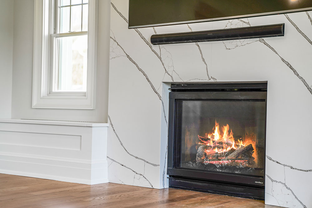 Fireplace surround with dramatic gold and gray veining